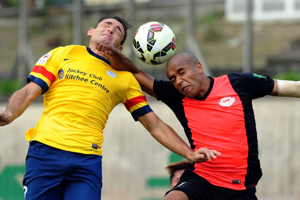 Kitchee's Juan Belencoso (left) goes for a header  during his team's 2-0 win over Wong Tai Sin. Photo: Xinhua