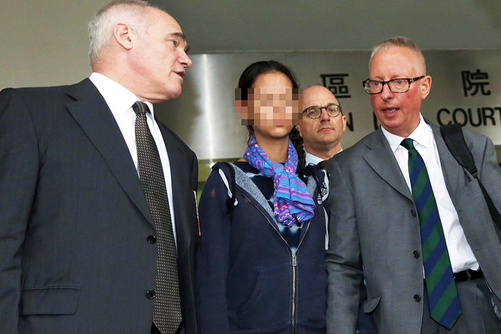 Nick Cousins (right) with his daughter and barrister Nigel Kat (left) outside Eastern Court yesterday. Photo: SCMP Pictures