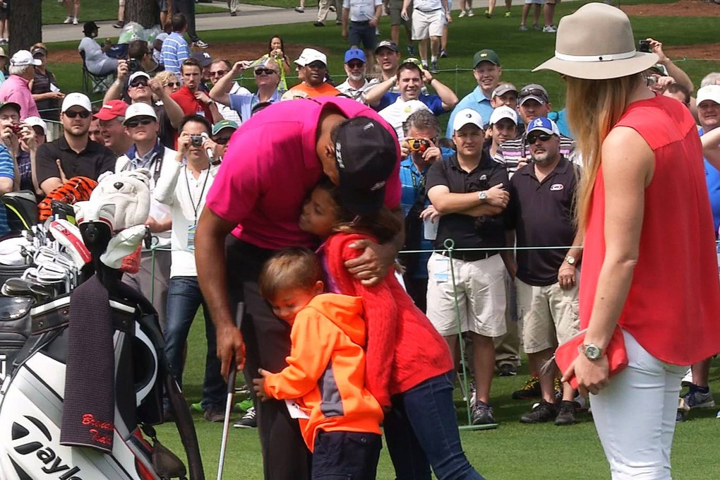 Tiger Woods with his kids and girlfriend at Augusta. Photo: Reuters