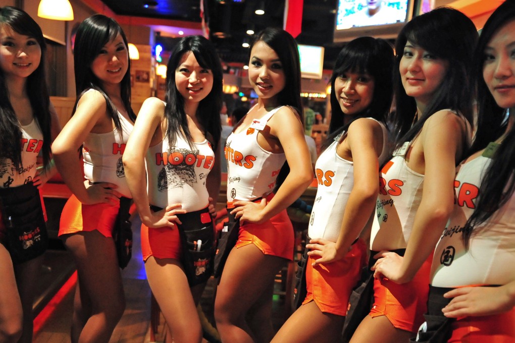 Staff at a Hooters restaurant in Beijing. Photo: AFP