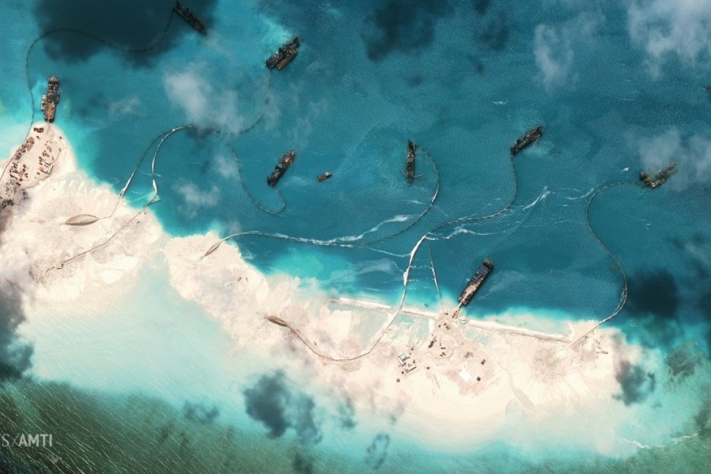 This image provided by the Washington-based Center for Strategic and International Studies (CSIS) shows what it described as a chain of small artificial land formations as well as new structures, fortified seawalls and construction equipment on Mischief Reef, on March 16, 2015. Photo: Asia Maritime Transparency Initiative/Digital Globe