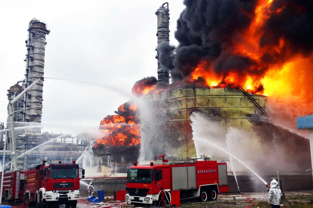 Firefighters battle a blaze following an explosion at a plant producing paraxylene in Zhangzhou, Fujian. Photo: AFP