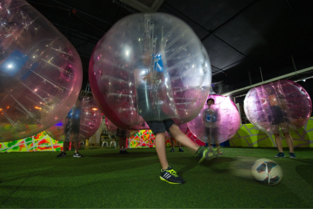 A game of bubble soccer in the dark at Wong Chuk Hang.