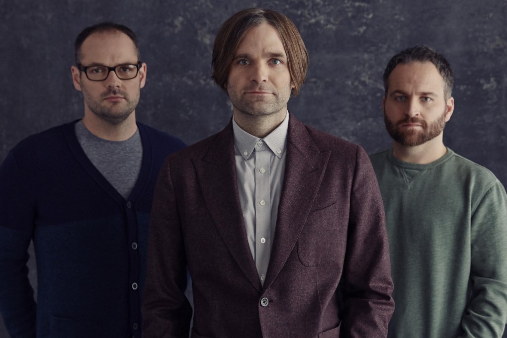 Ben Gibbard (centre) with current Death Cab for Cutie members Nick Harmer (left) and Jason McGerr.