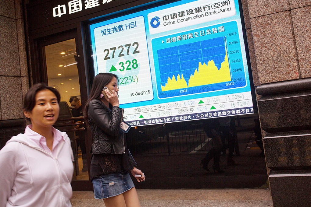 A monitor displays the Hang Seng Index outside a securities firm. Photo: EPA