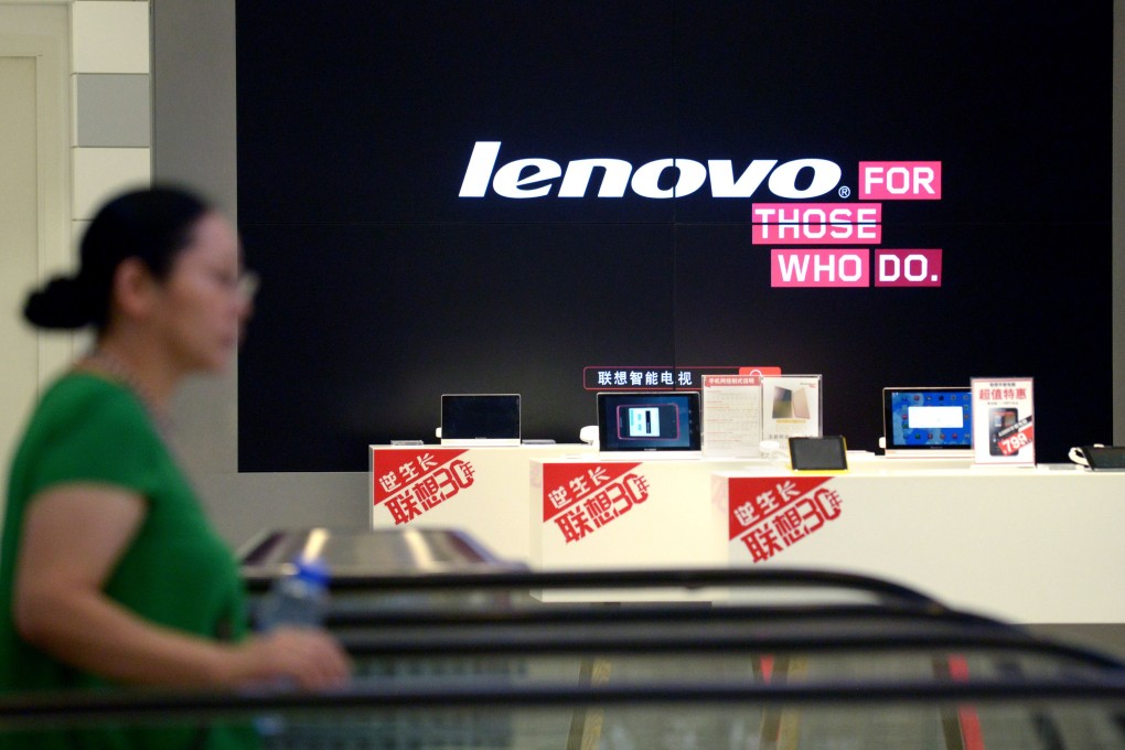 A woman walks past a Lenovo store in Beijing. Lenovo, the world’s largest supplier of personal computers, grew its shipments by 3.4 per cent to 13.39 million units in the quarter to March. Photo: AFP