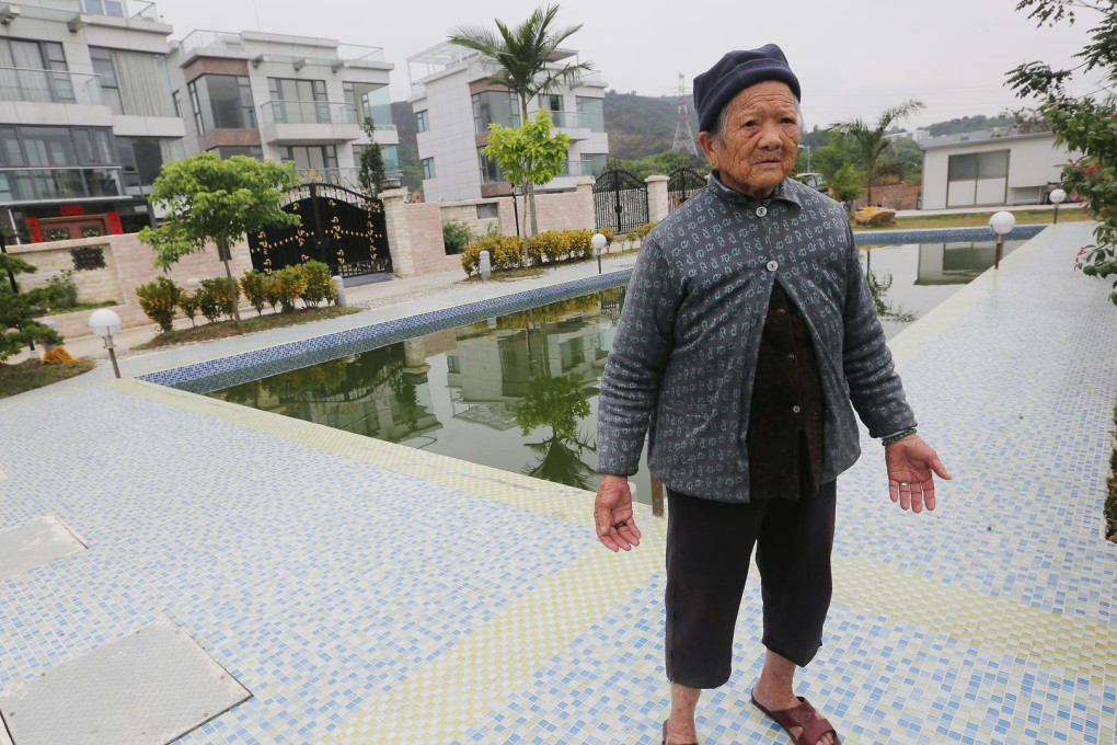 Lau Oi-kiu in front of what were her fields. Photo: Sam Tsang