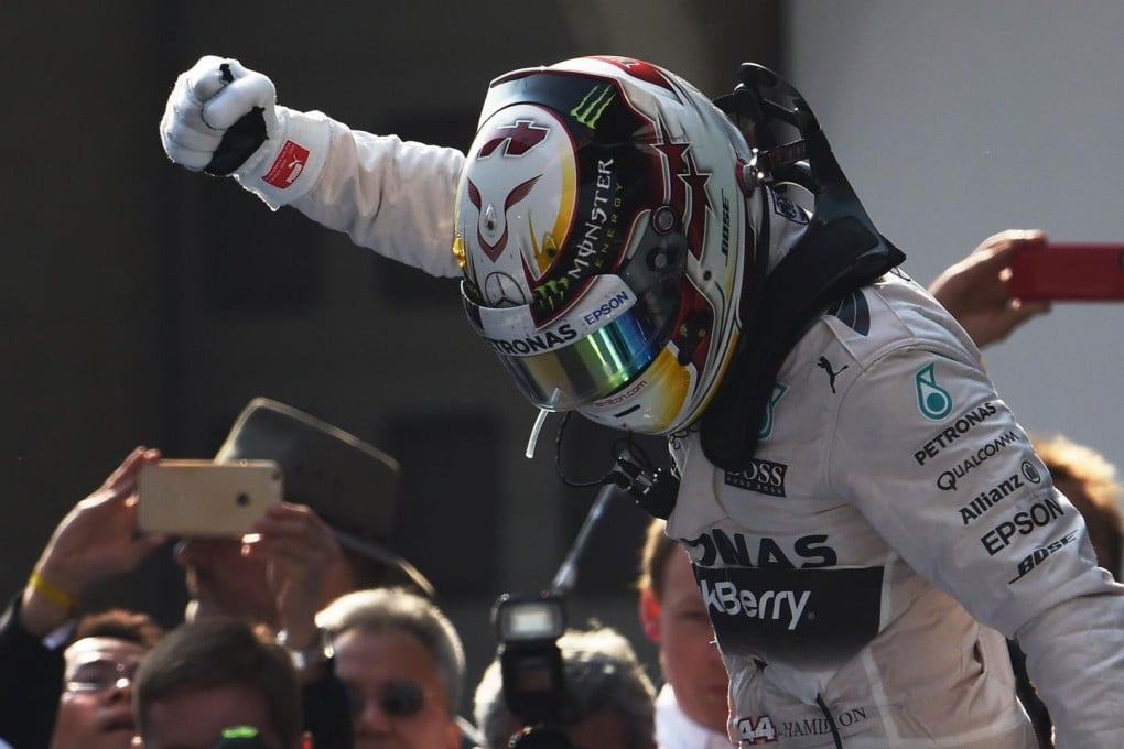 Lewis Hamilton celebrates after comfortably taking the Chinese Grand Prix, extending an early lead in the championship. Photo: AFP