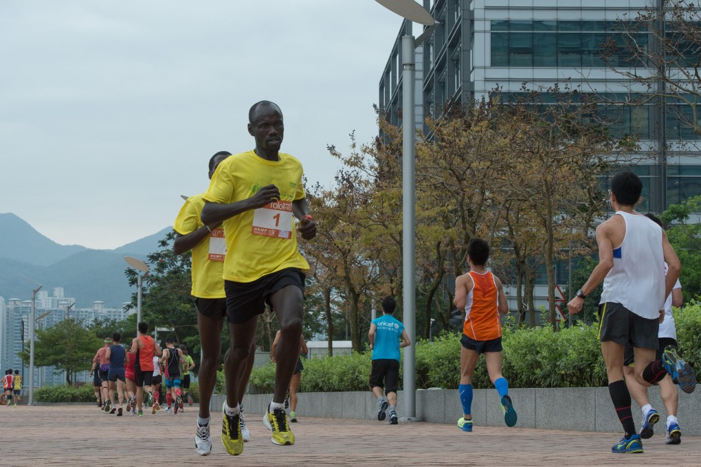 Kenyan athletes Stanley Cheruiyot Teimet (1) and Bett Kipngetich race in the Tolo Harbour 10km on Sunday. Photo: Richard Castka