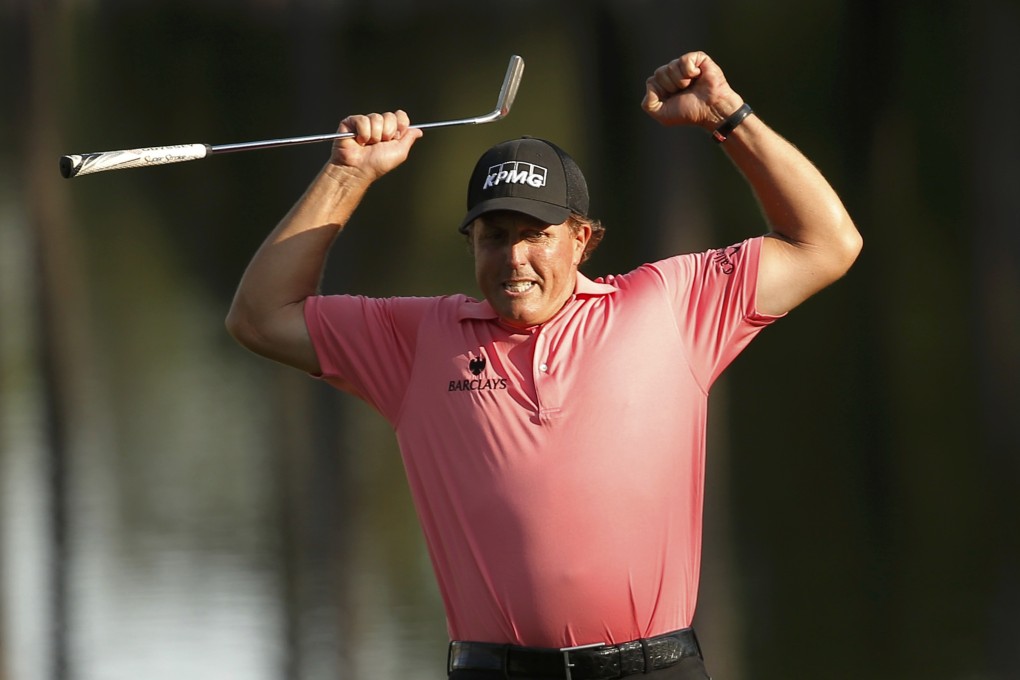 Phil Mickelson celebrates a long birdie putt on 16. Photo: Reuters