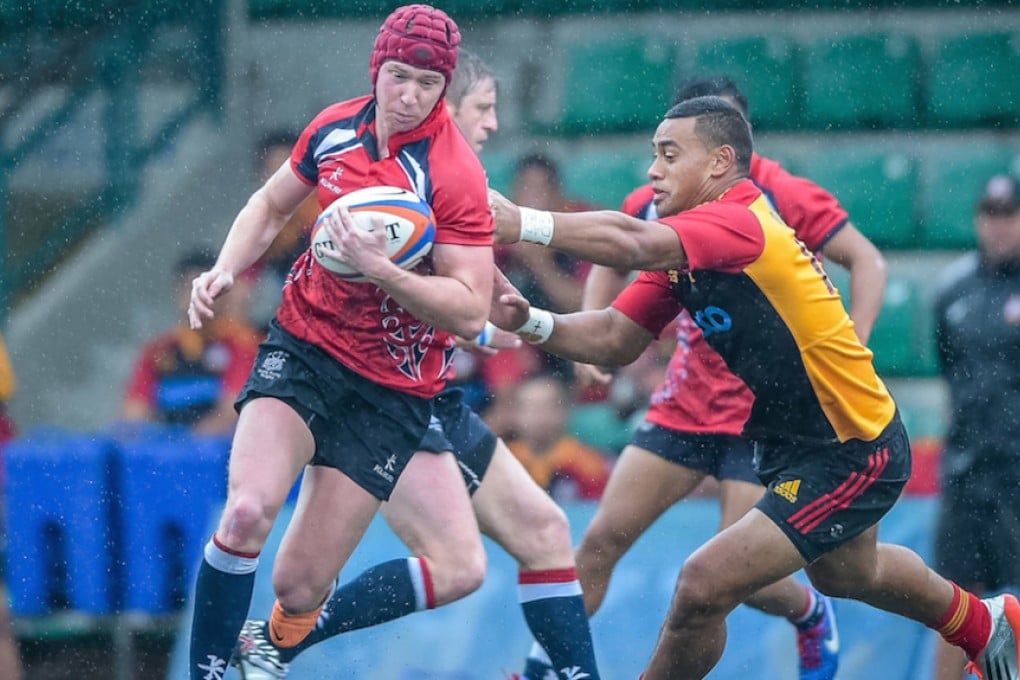 Hong Kong fly-half Chris McAdam eludes the Chiefs Development defence. Photos: SCMP Pictures/HKRFU