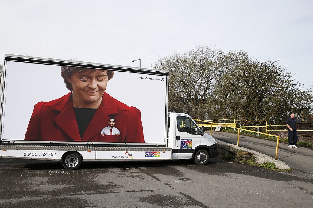 A Conservative election ad showing Britain's opposition Labour Party leader in the pocket of SNP leader Nicola Sturgeon is seen on a truck parked in Manchester. Photo: Reuters
