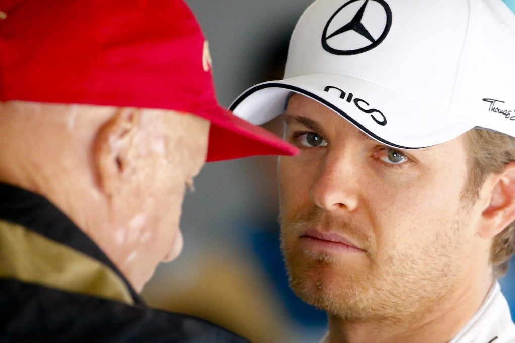 German driver Nico Rosberg talking to former F1 world champion Niki Lauda. Photo: EPA
