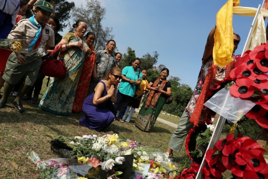 Members of the local Nepalese community observe Purkha Divas memorial day at the Gurkha Cemetery. Photo: Jonathan Wong