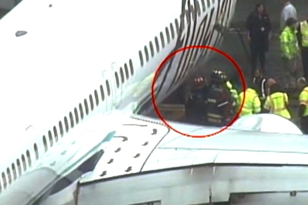 A cargo worker was removed from the cargo hold of an Alaska Airlines passenger airplane on Monday at Seattle-Tacoma International Airport. Photo: Kiro 7/AP