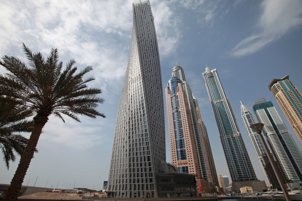Cayan built the landmark 307-metre twisted skyscraper in Dubai Marina. Photo: EPA