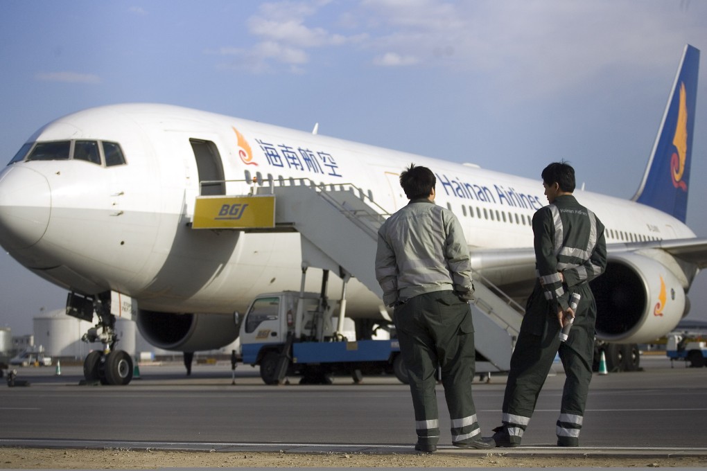 A Hainan Airlines plane sits on the tarmac in Beijing. Photo: Bloomberg