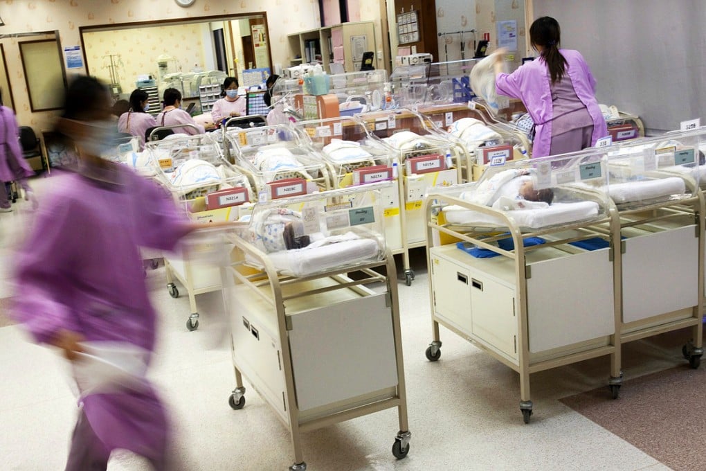 Hospital staff attend to new born babies in the nursery ward of the Union Hospital in Hong Kong. Photo: Bloomberg