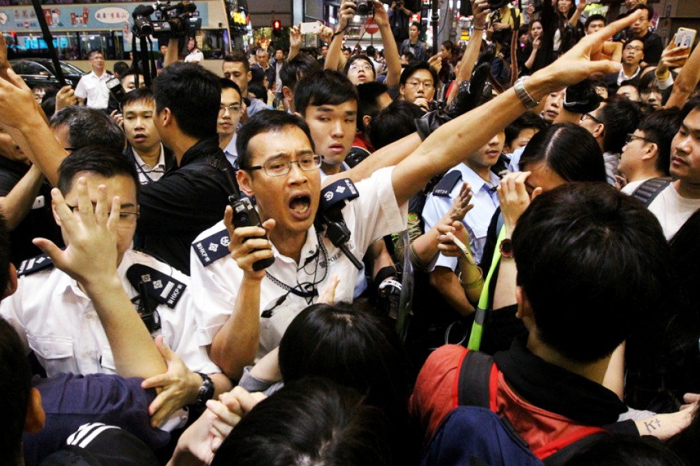 Police officers clash with pro-democracy protesters in Mong Kok. Photo: Edward Wong