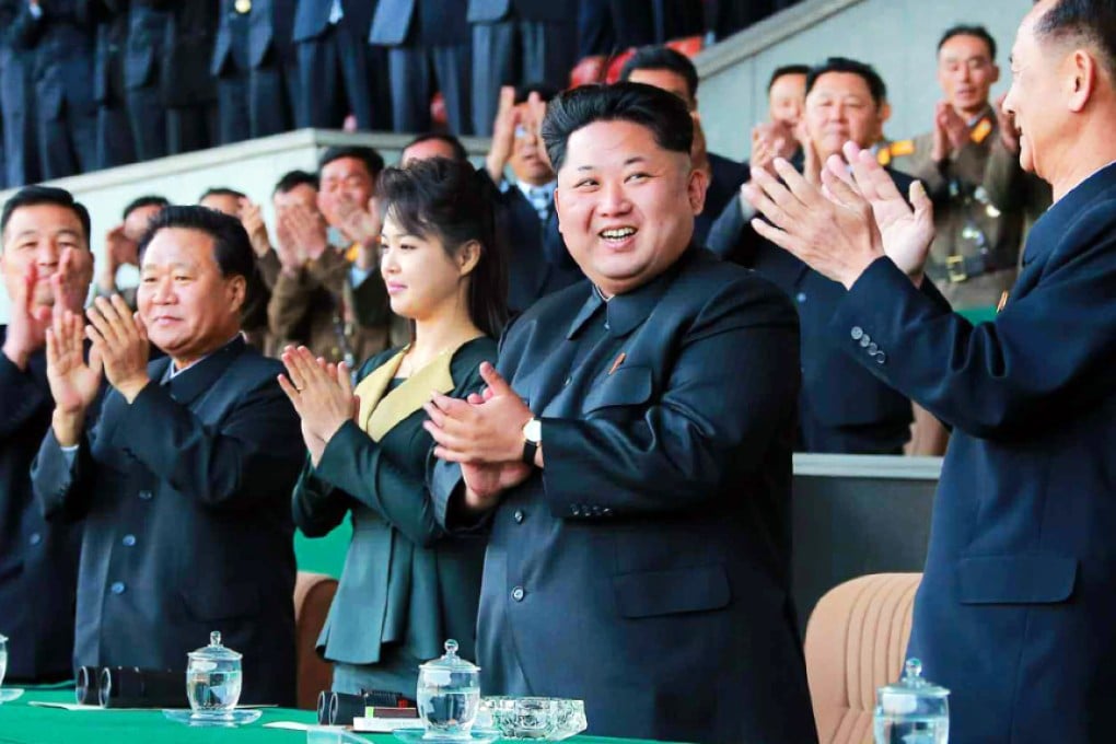 Ri Sol-ju (4th from left), wife of North Korean leader Kim Jong-un (2nd from right), applaud a men's soccer match at Kim Il-sung Stadium in Pyongyang as part of celebrations honouring the birthday of Kim patriarch Il-sung. Photo: EPA