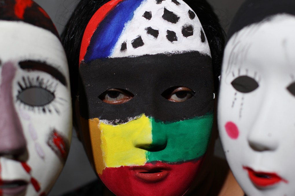 Masks painted by an asylum seeker were displayed at an exhibition on asylum seekers in Hong Kong last year. Photo: Nora Tam