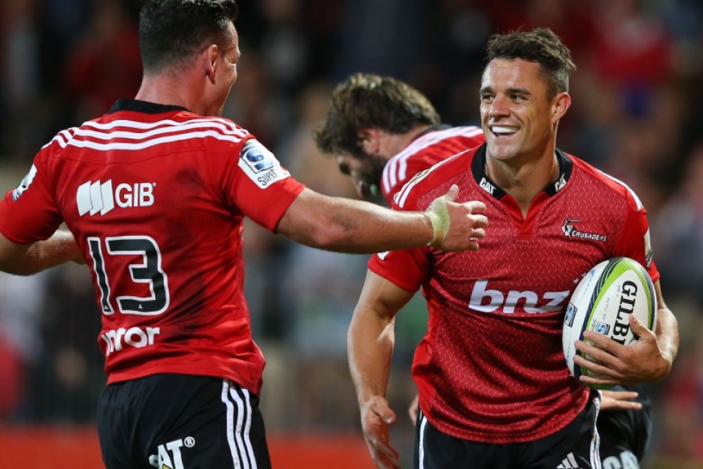Dan Carter (right) has already announced his decision to join the New Zealand exodus later this year, but his Crusaders and All Blacks team-mate Ryan Crotty (left) is yet to confirm his post-World Cup future. Photo: AFP
