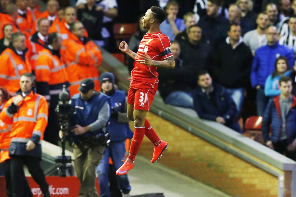 Raheem Sterling jumps for joy after opening the scoring for Liverpool against Newcastle at Anfield. Photo: Reuters