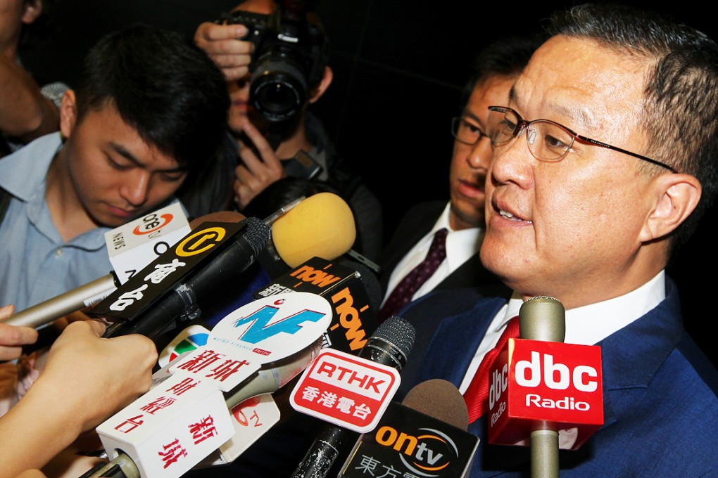 Executive Councillor Barry Cheung Chun-yuen speaks to media after police seized evidences from the office of Hong Kong Mercantile Exchange's (HKMEx) office at Cyberport in 2013. Photo: May Tse