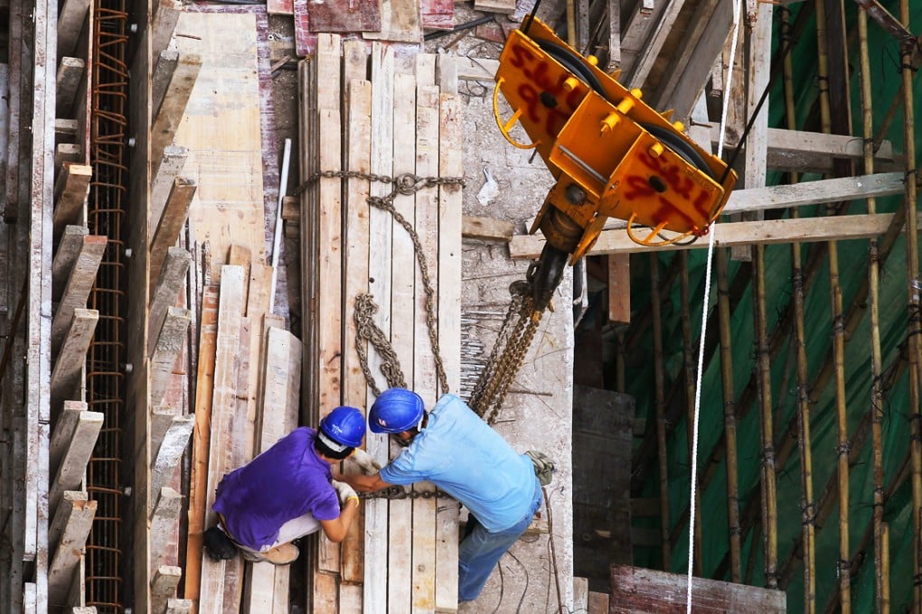 Construction workers can earn HK$1,100 to HK$1,300 a day. Photo: Felix Wong