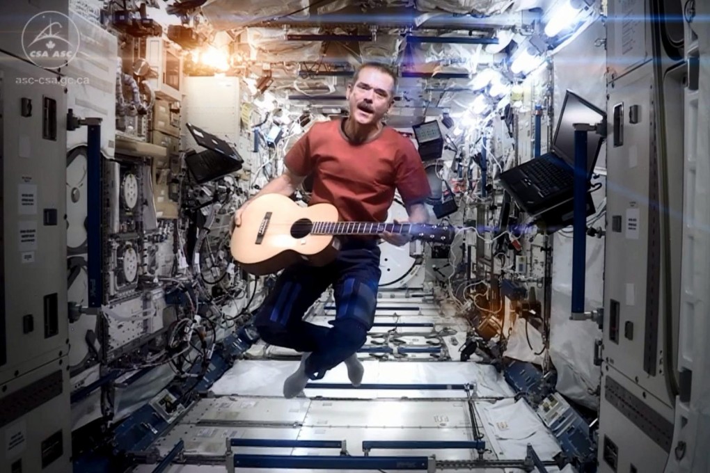 Astronaut Chris Hadfield performs on the ISS.Photo: EPA