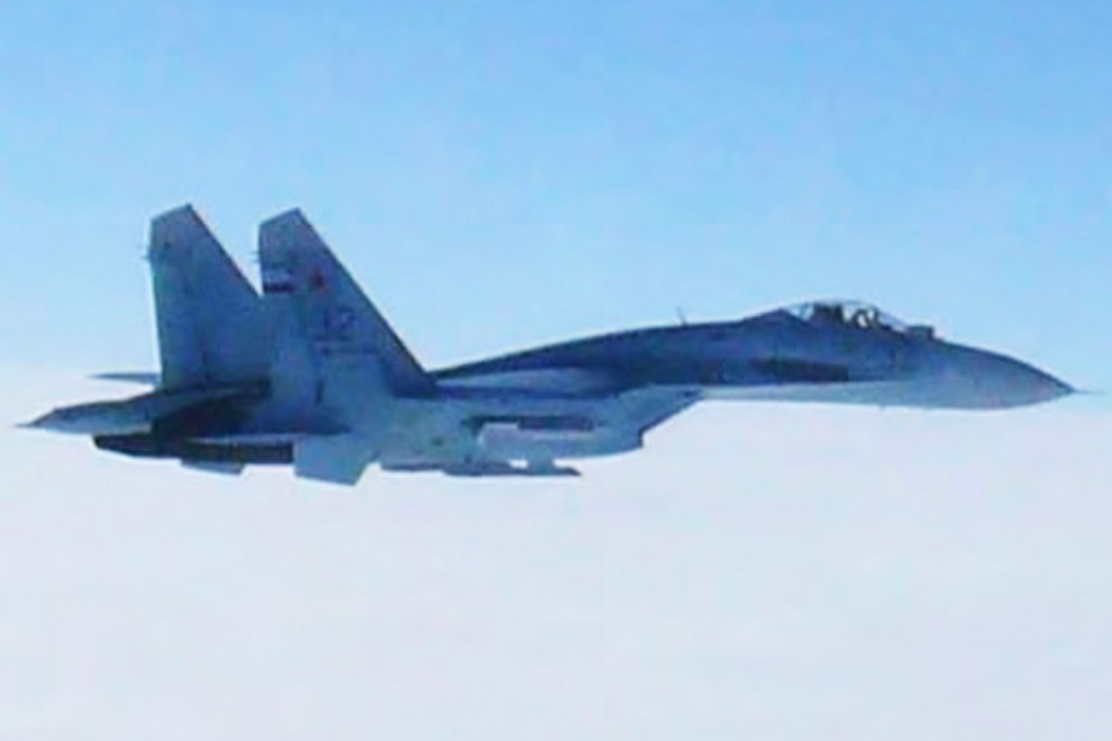 Russian fighter jet SU-27 flies over the sea off the Japanese island of Hokkaido when the Defense Ministry said two SU-27 jets, including the one shown in this photo, briefly intruded into Japanese airspace in the afternoon off the coast of Rishiri island on Hokkaido's west coast, prompting Japan's air force to scramble jets. Photo: AP