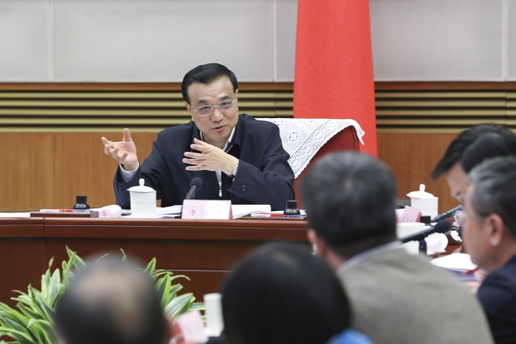 Chinese Premier Li Keqiang presides over a symposium on current economic situation in Beijing. Photo: Xinhua