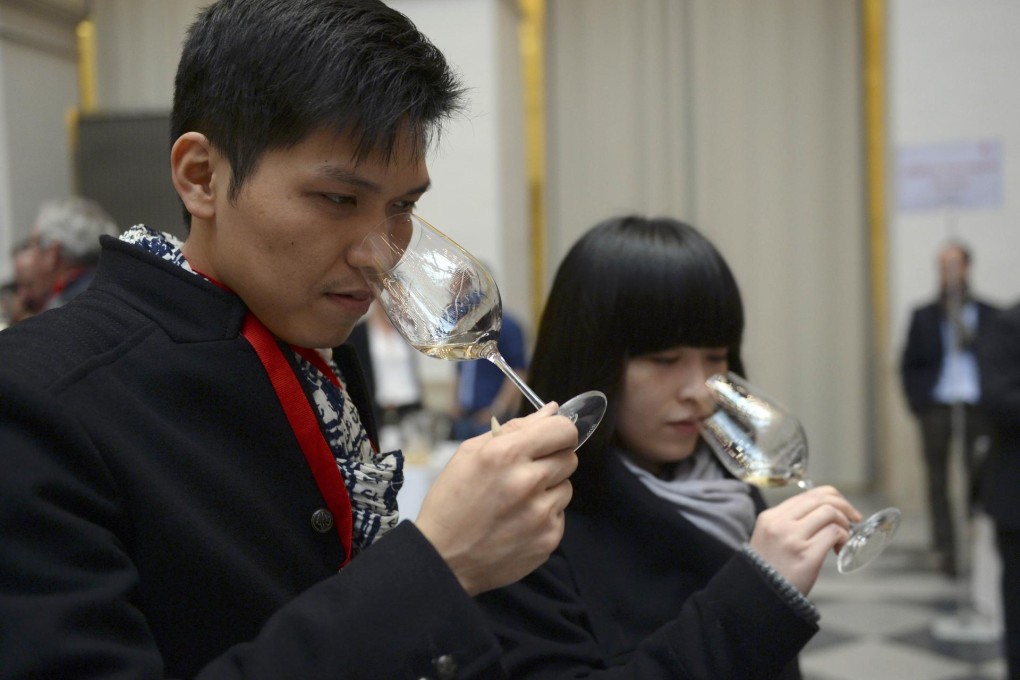Wine traders at a tasting during en primeur week in Bordeaux. Photo: AFP