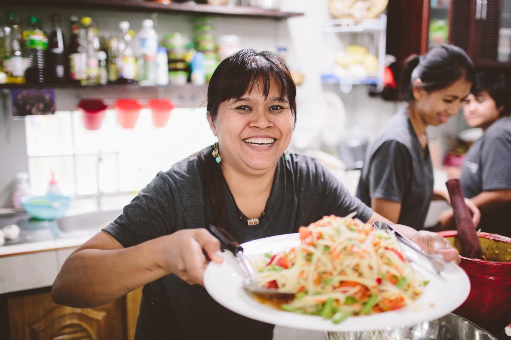 Saiyuud Diwong with papaya salad at her Bangkok cooking school. Photo: Allison Harp