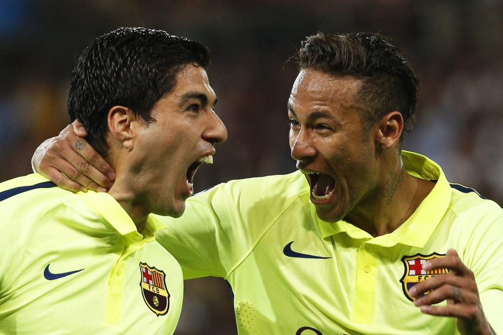 Luis Suarez and Neymar celebrate. Photo: EPA