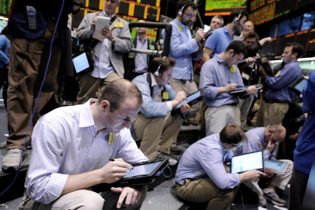 Traders working the pit in the New York Mercantile Exchange, where oil futures contracts are traded. Photo: EPA