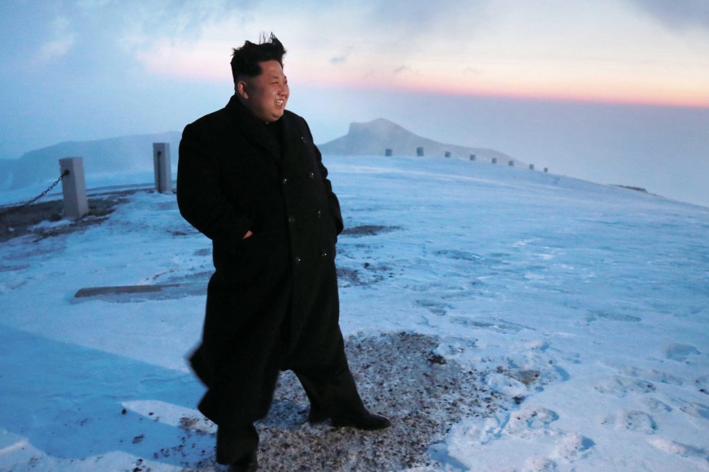 North Korean leader Kim Jong-un takes in the view from the summit of a snow-covered Mount Paedku. Photo: EPA