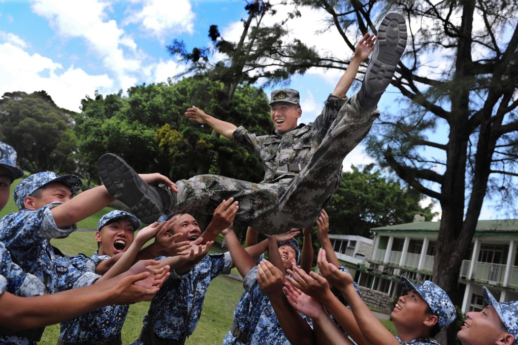 Civil servants from Luohu district in Shenzhen have been undergoing military training similar to these Hong Kong students in 2011. Photo: Xinhua