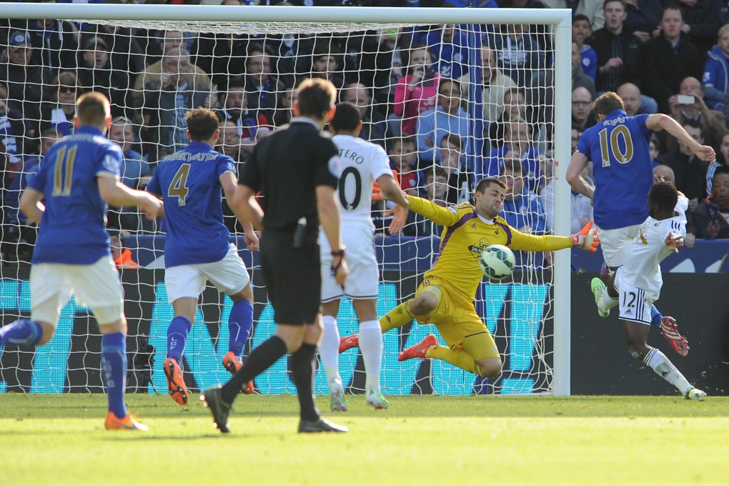 Andy King (right) scores late to seal Leicester City's 2-0 win over Swansea City in their English Premier League match. Photo: AP