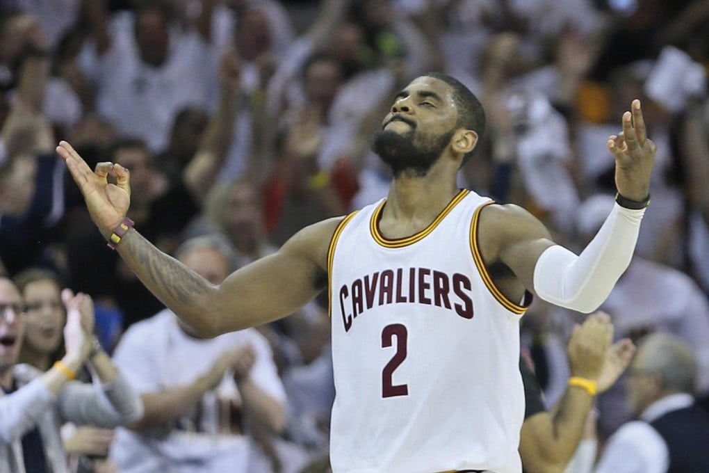 The Cavaliers' Kyrie Irving celebrates after he sinks a three-pointer against the Boston Celtics at Quicken Loans Arena. Irving scored 30 points for his team. Photo: TNS