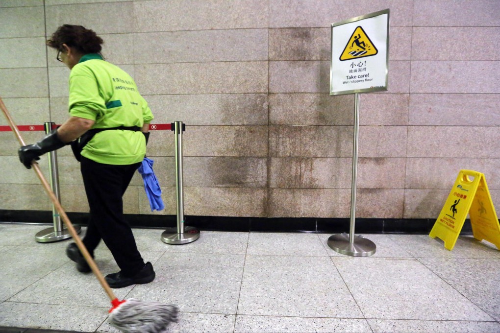 A water leak leads to wet walls and caution signs at the new HKU station. The MTR Corporation said such issues were not a result of rushed work.Photo: Felix Wong