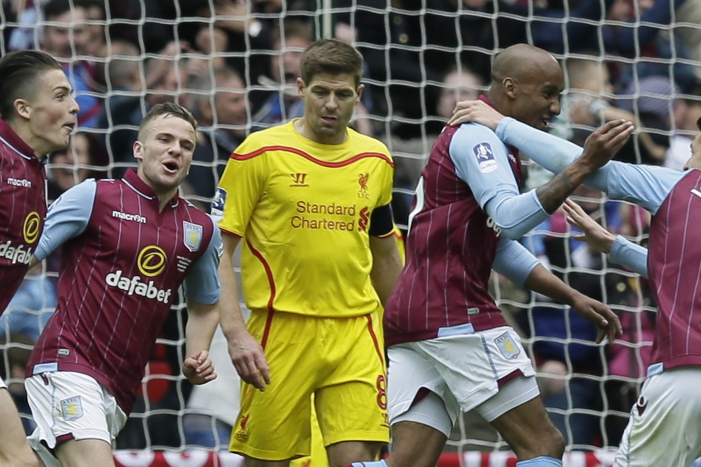Aston Villa celebrate Fabian Delph's goal behind Steven Gerrard. Photo: AP