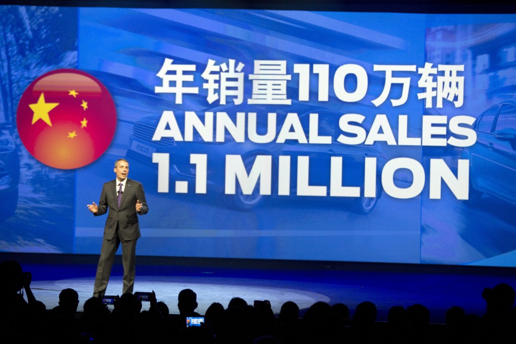 John Lawler, Chairman and CEO for Ford Motor China, talks about sales in China at a media event ahead of the Auto Shanghai show in Shanghai. Photo: AP