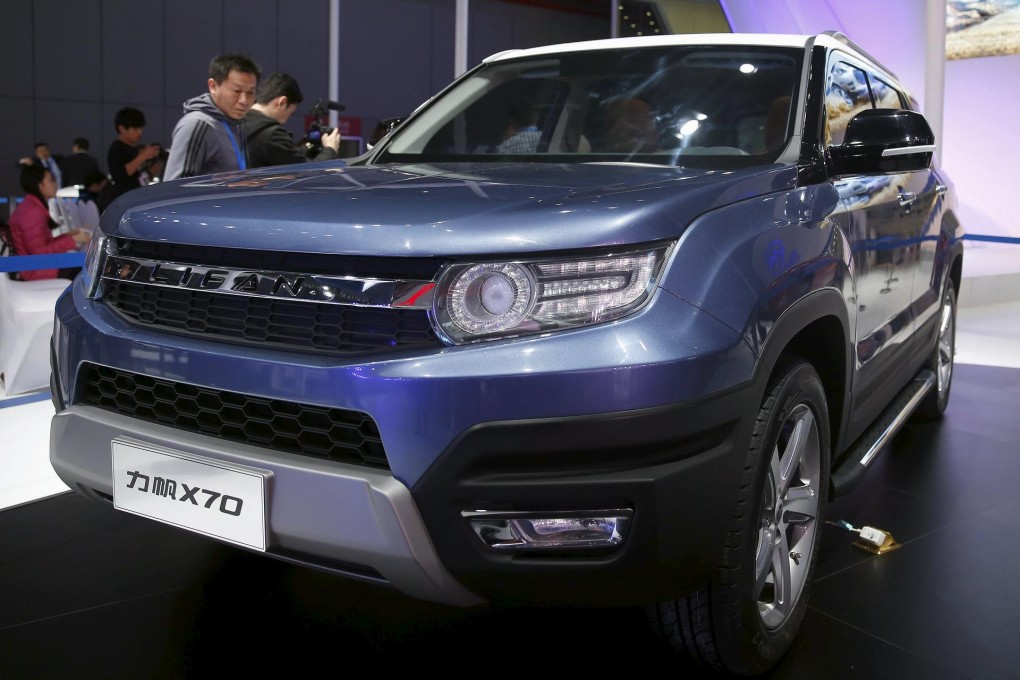 A visitor takes a closer look at a Lifan X70 SUV at the Shanghai car show. Demand for luxury SUVs in China is expected to grow. Photo: Reuters