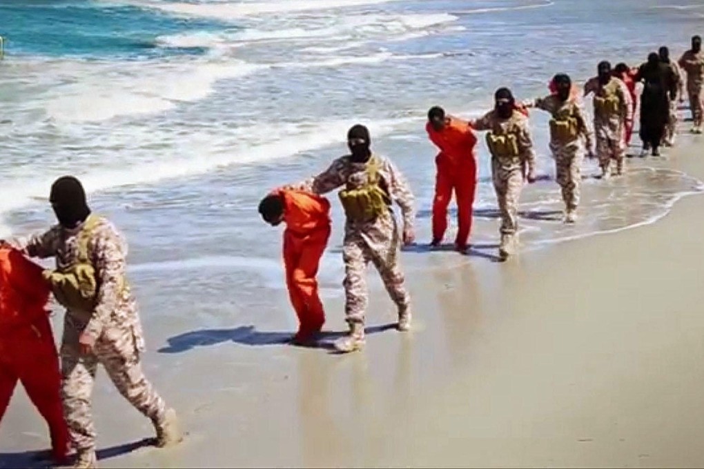 Ethiopian Christians captured in Libya are seen being marched along a beach to their deaths by masked militants (above and right). Some were executed in a desert area (left).Photos: AFP