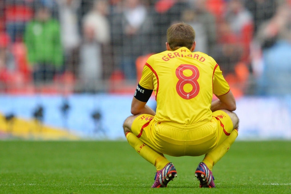 Liverpool captain Steven Gerrard reacts after losing the FA Cup semi-final against Aston Villa at Wembley. Photos: AFP