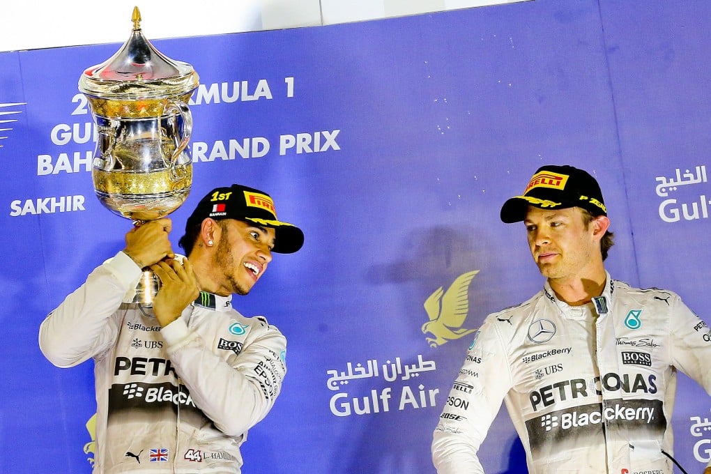 Lewis Hamilton of Mercedes celebrates his win next to third placed teammate Nico Rosberg following the Formula One Grand Prix of Bahrain at the Sakhir circuit near Manama. Photo: EPA