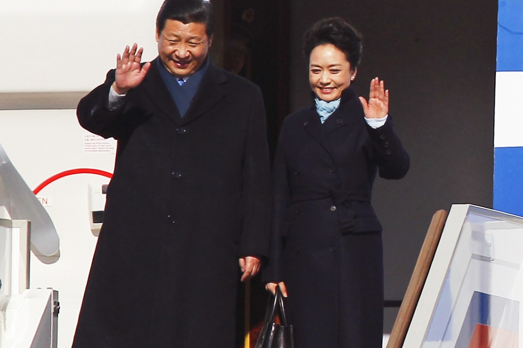 First lady Peng Liyuan (right) helped make Exception a household name by sporting one of the brand's coats and bags during her first trip overseas. Photo: Reuters