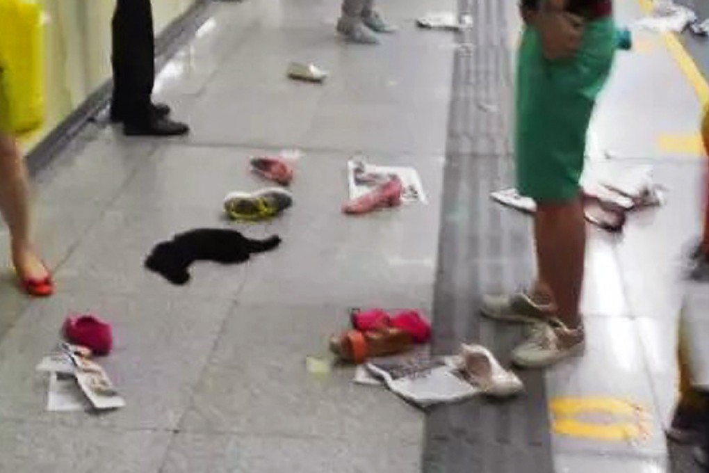 The subway platform was left covered with people's shoes, bags and even partly eaten food following the rush-hour stampede at Shenzhen's Huangbeiling Station on Monday. Photo: SCMP Pictures