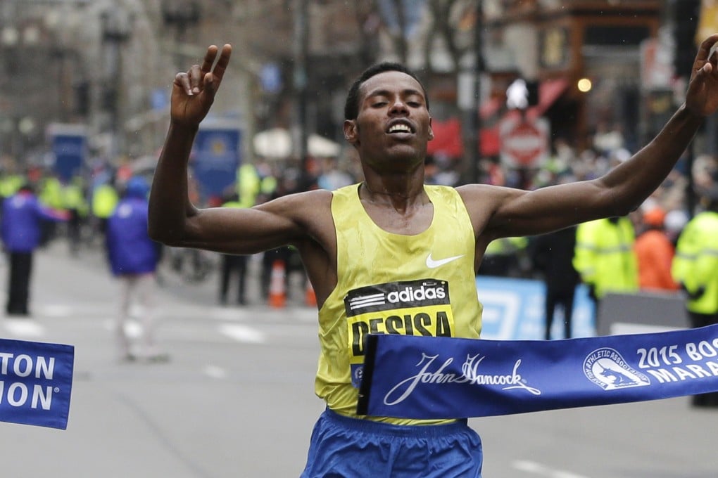Lelisa Desisa, of Ethiopia, crosses the finish line to win the  Boston Marathon. Photo: AP